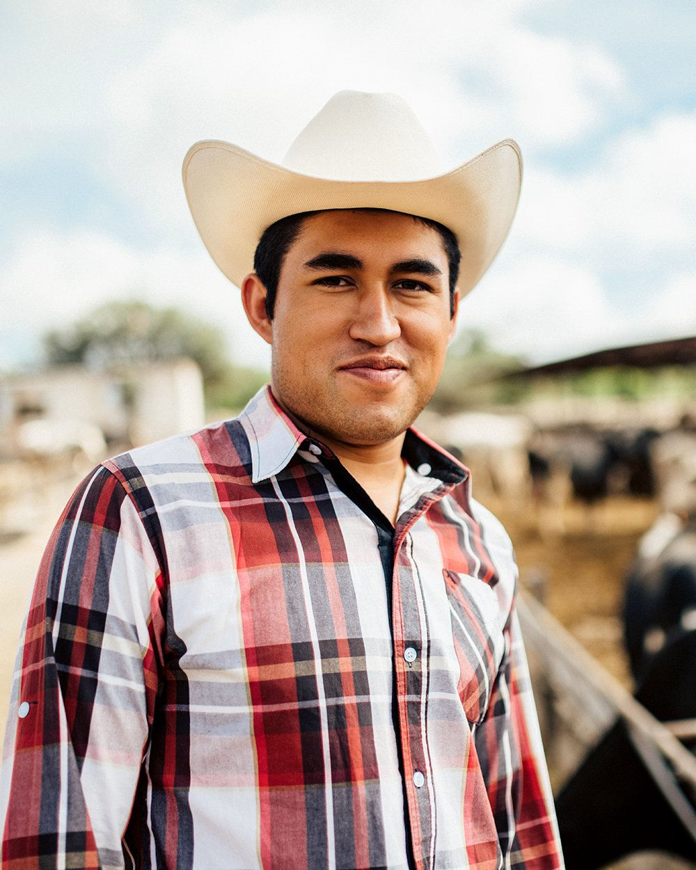 Oklahoman farmer working in cattle farm.