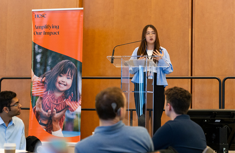 HCSC employee Kira Luo talks to summer interns